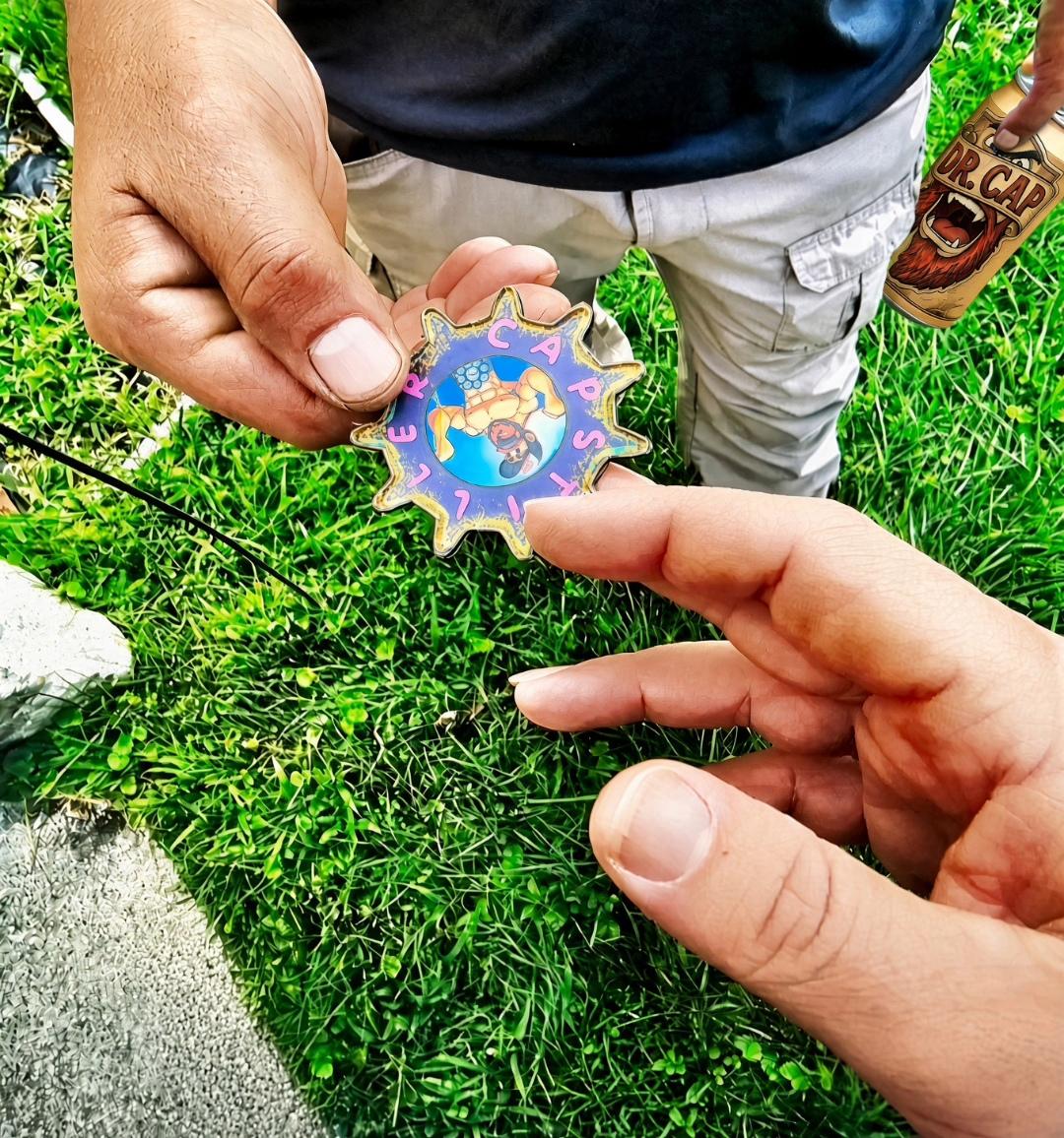 Hands passing an IRL GEAR token